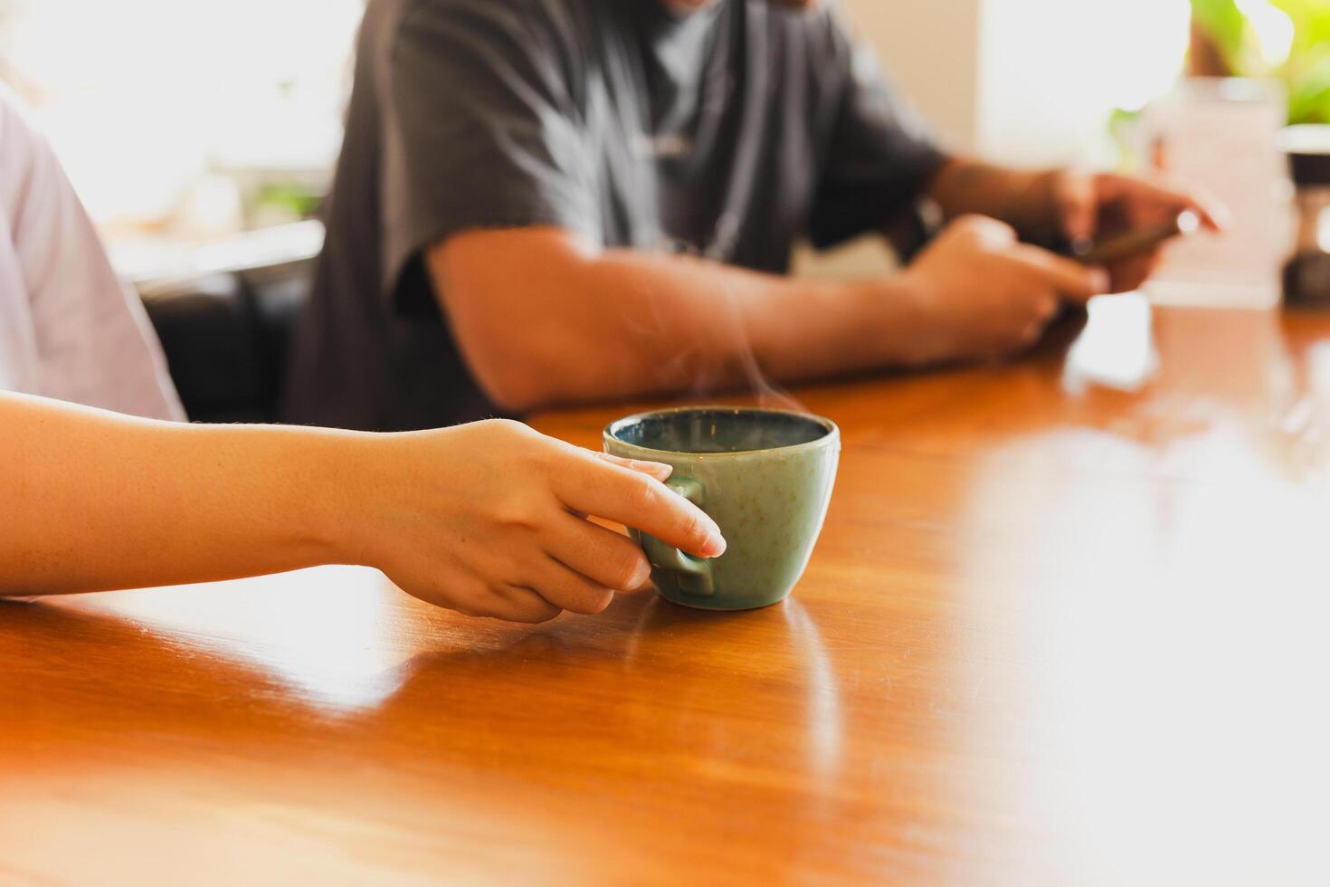 Woman and man relaxing in morning drink coffee in cafe. photo