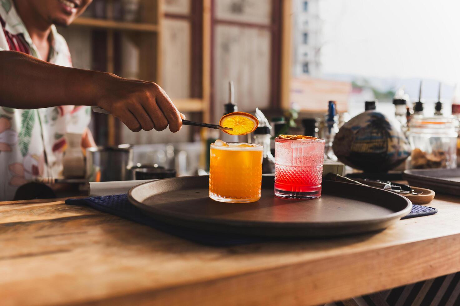 Bartender serving an alcoholic cocktail drink in a bar. photo