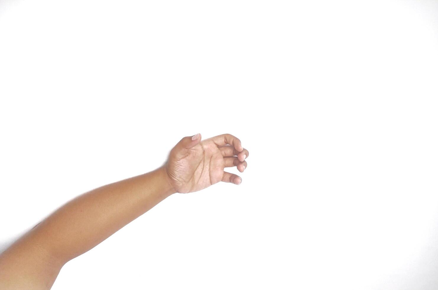 Hand holding an invisible object, isolated on white. Asian male hand in a gesture of giving or grabbing, perfect for concepts of interaction and communication. Close up view photo