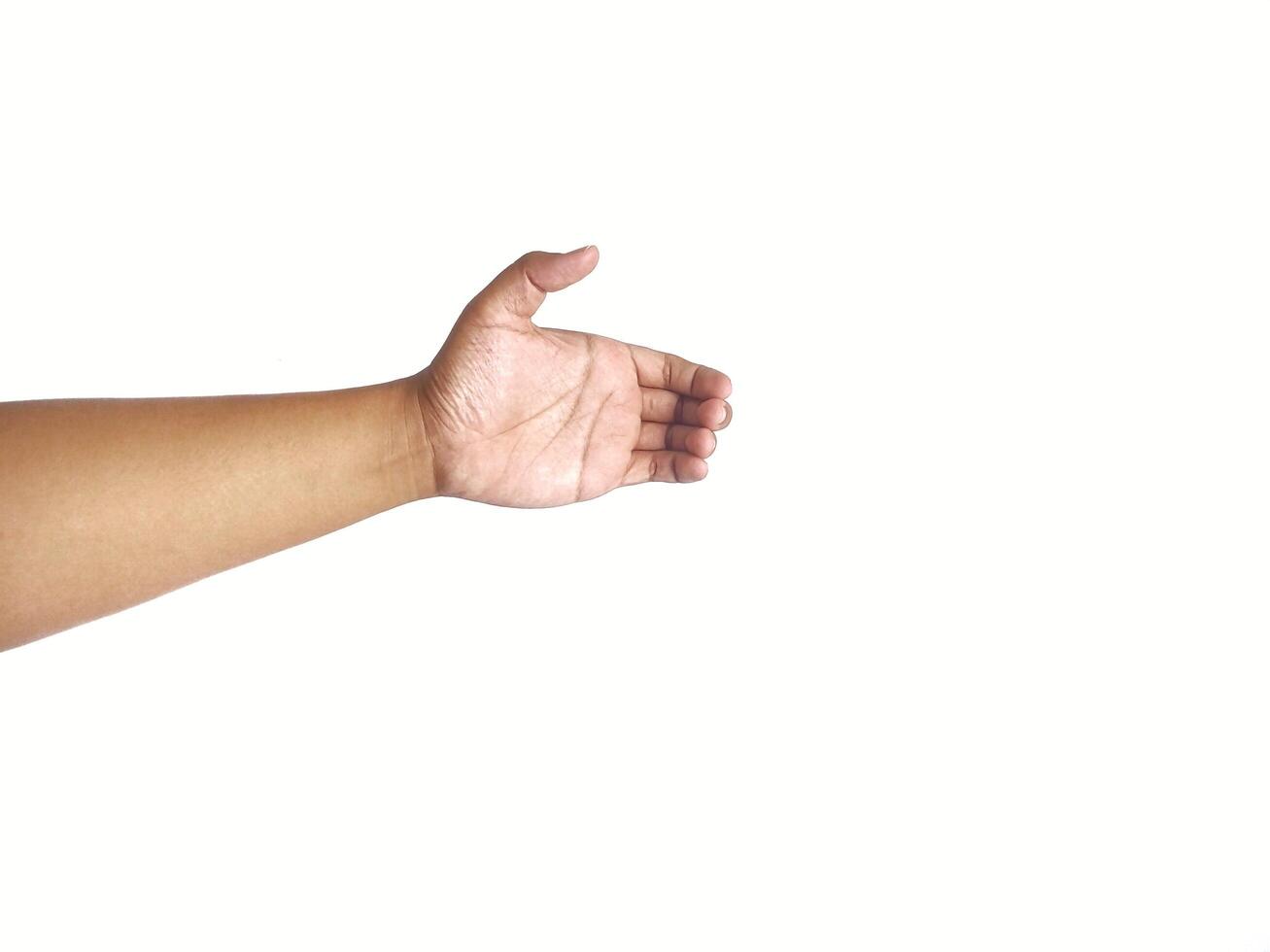 Hand holding an invisible object, isolated on white. Asian male hand in a gesture of giving or grabbing, perfect for concepts of interaction and communication. Close up view photo
