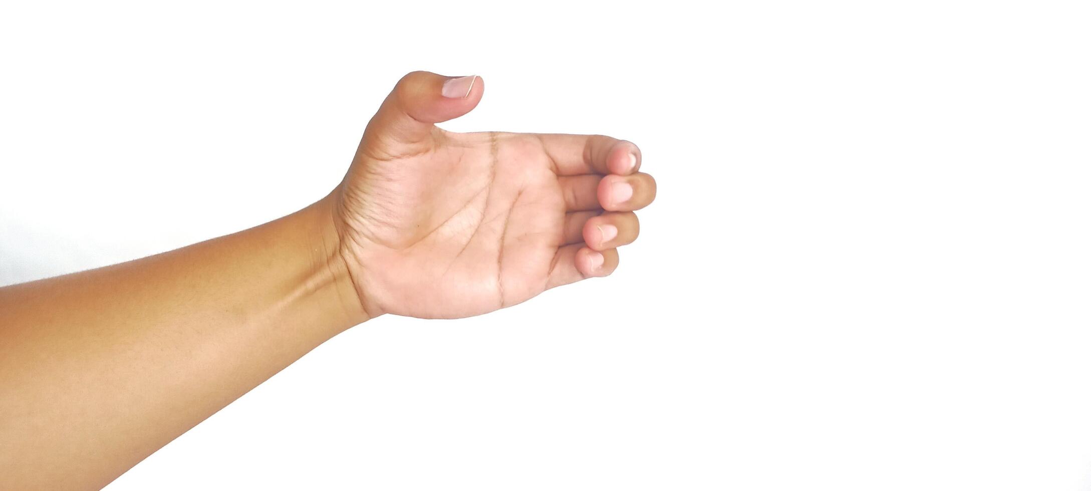Hand holding an invisible object, isolated on white. Asian male hand in a gesture of giving or grabbing, perfect for concepts of interaction and communication. Close up view photo