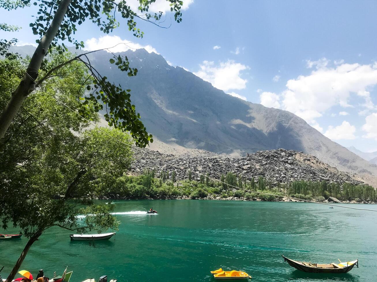 A view of Dal Lake in winter, and the beautiful mountain range in the background in the city of skardu , India. Suitable for banners, posts, social media, news, background. photo