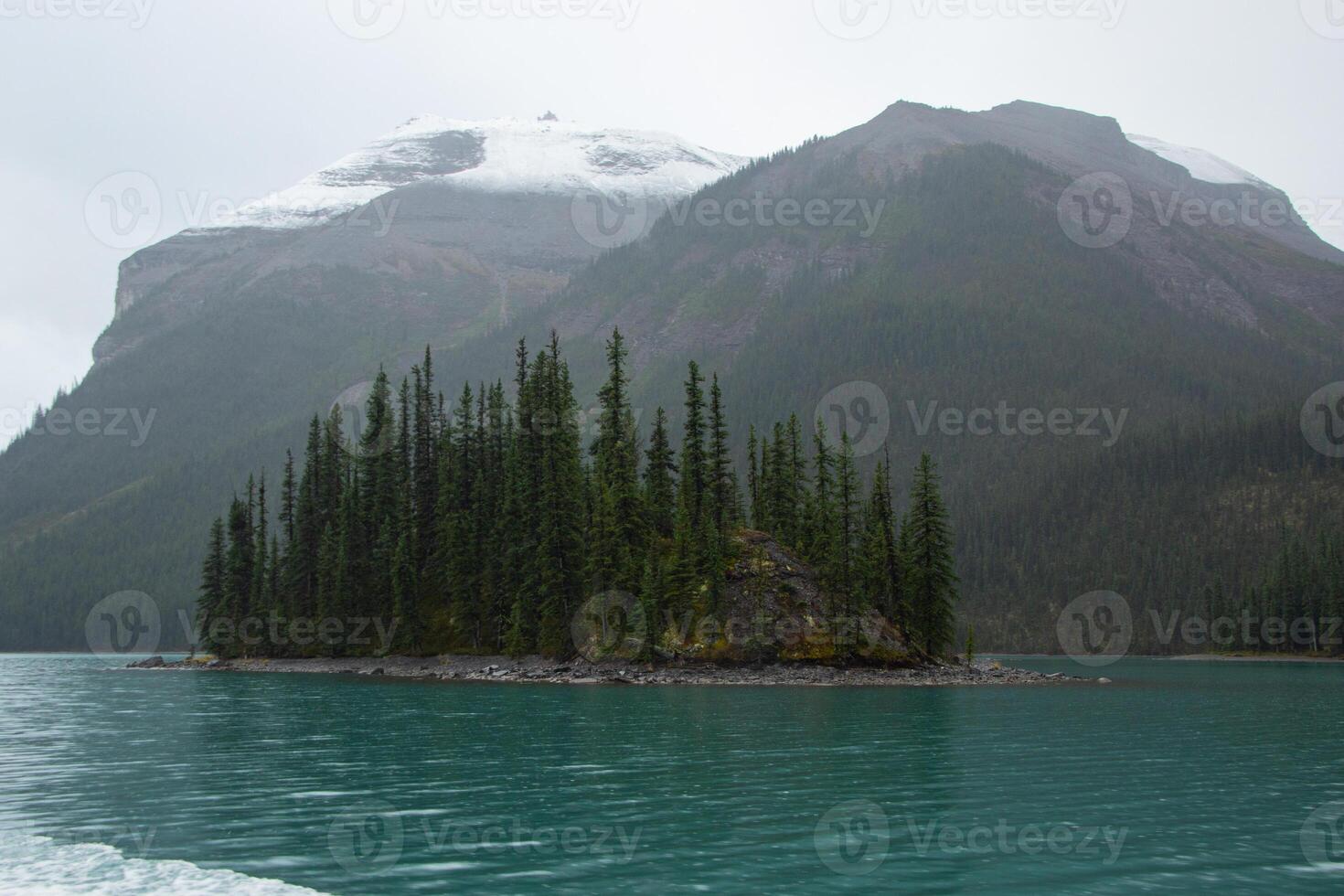 Small island in Maligne lake photo