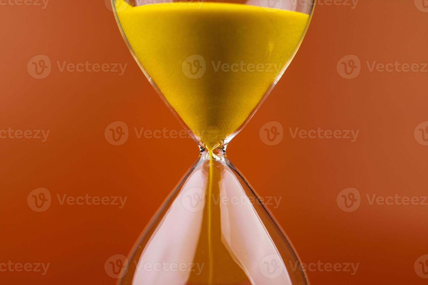 Hourglass with running out of time Concept of time and life Work with time as a deadline photo