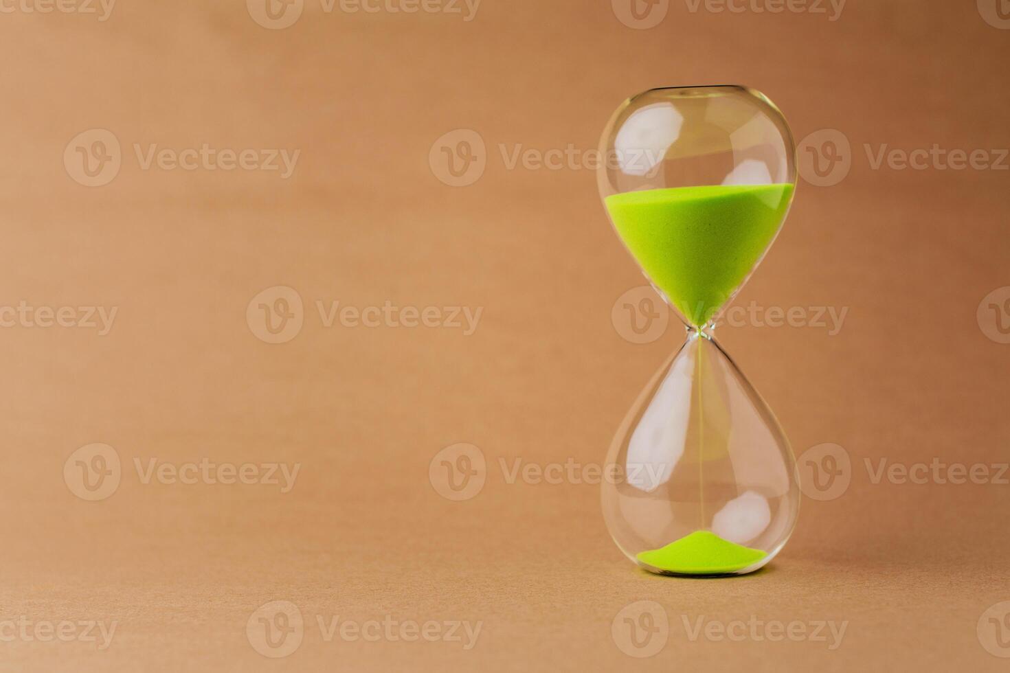 Hourglass tells time and works with limited time. Time requirements and life. photo