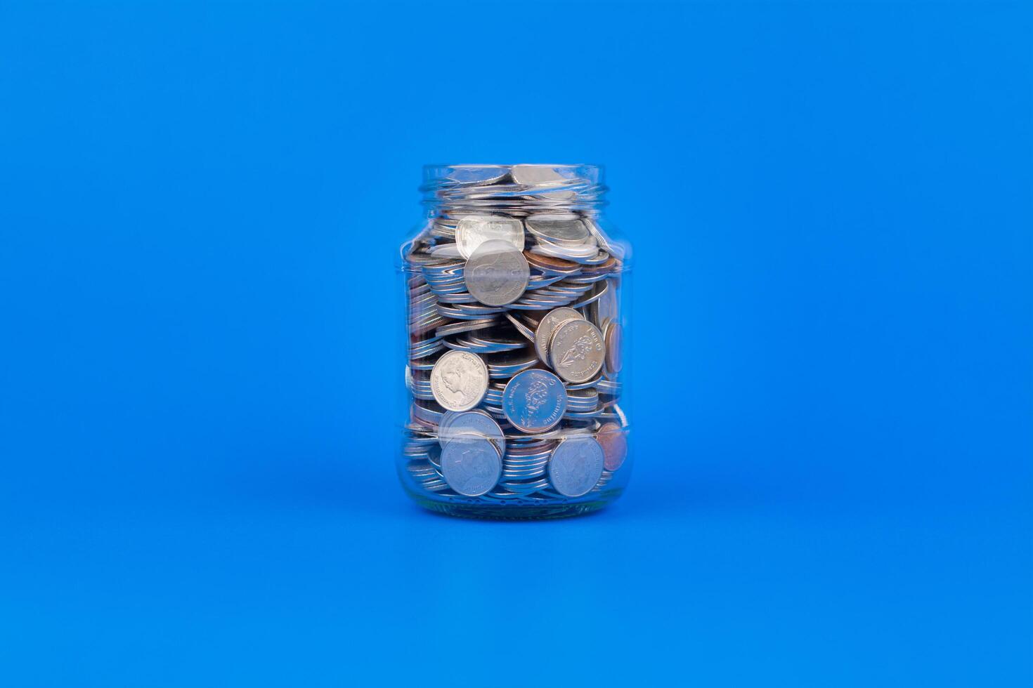 Saving Coins in Glass Bottle Financial Plan and Investment, Creating Financial Security and Asset Growth photo