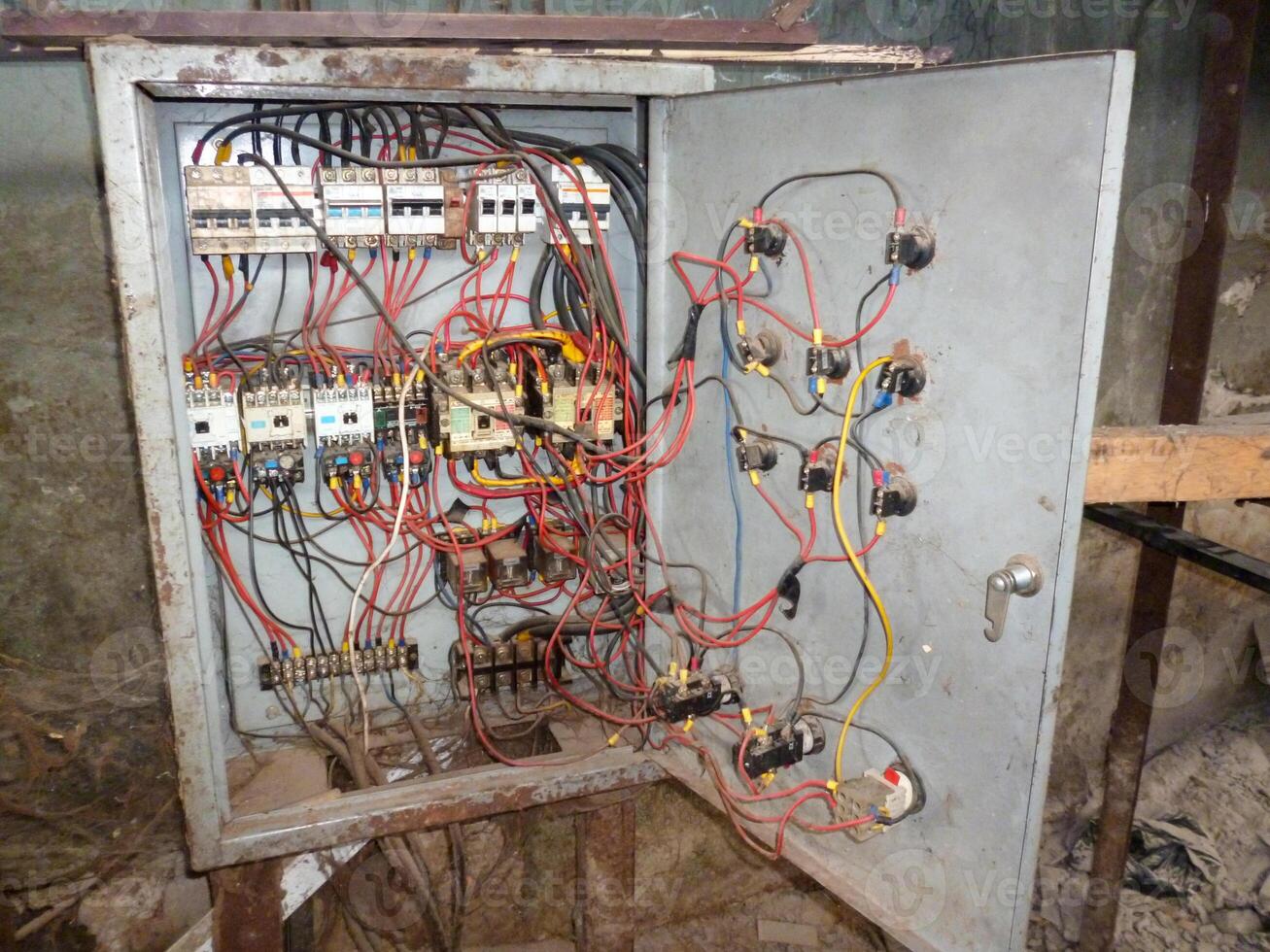 A box with wires and electrical equipment inside photo