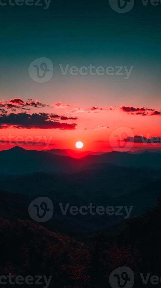 The sun sets over the mountains in this photo