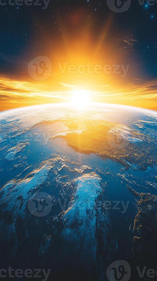 The sun rising over the earth from space photo