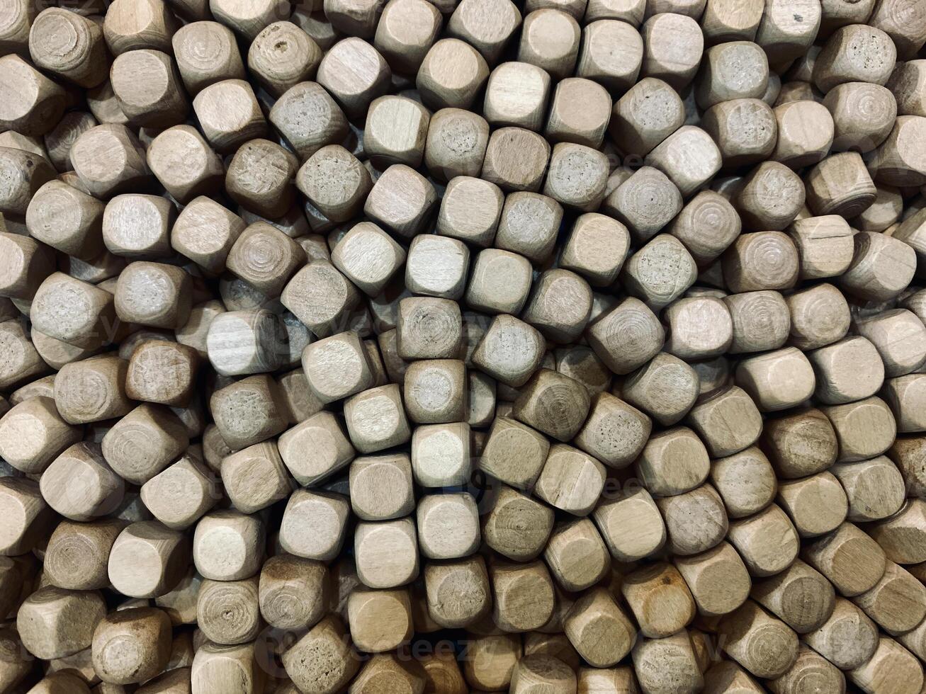 A close-up view of a collection of small round pieces of wood for children's toys. suitable for background photo