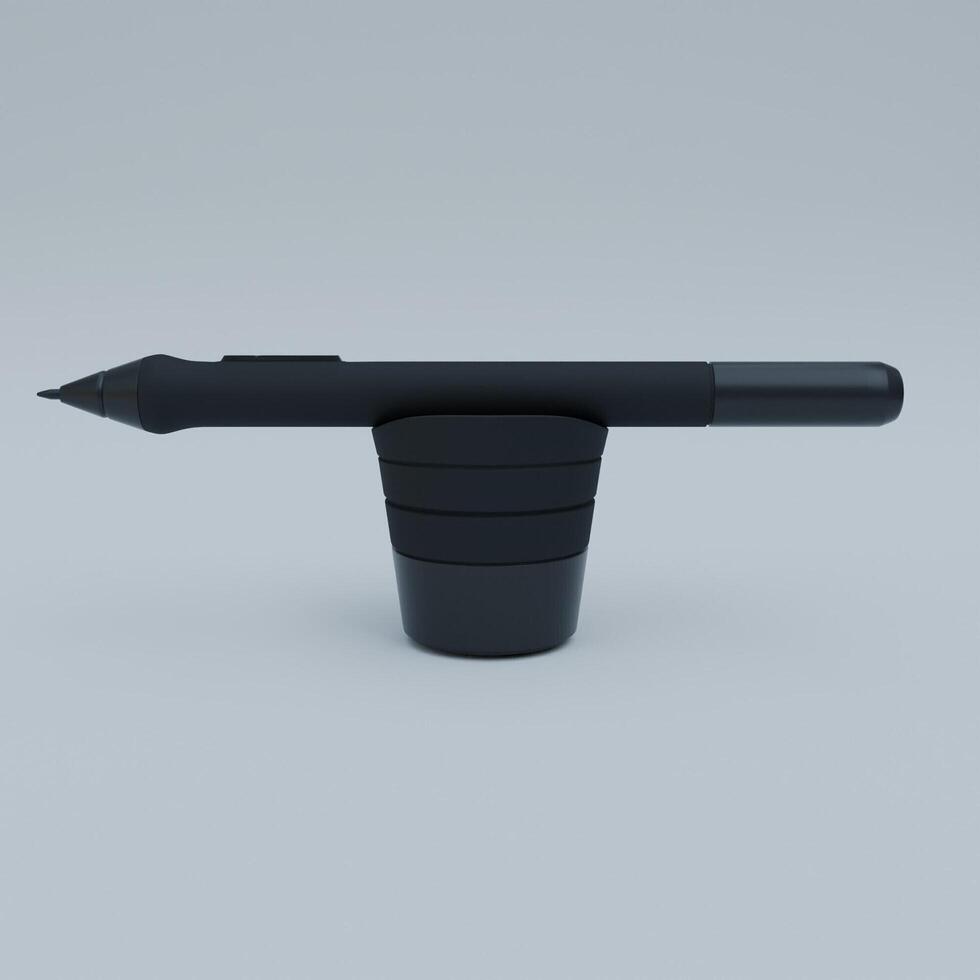 A pen and a cup sitting on top of each other photo