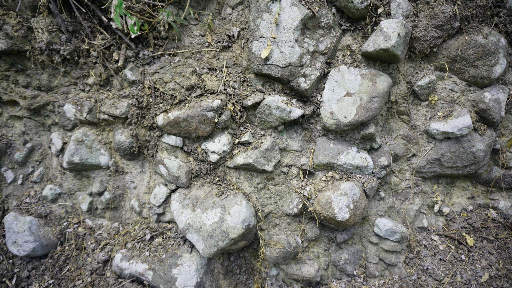 Old stone wall texture background, close-up of stone wall. photo