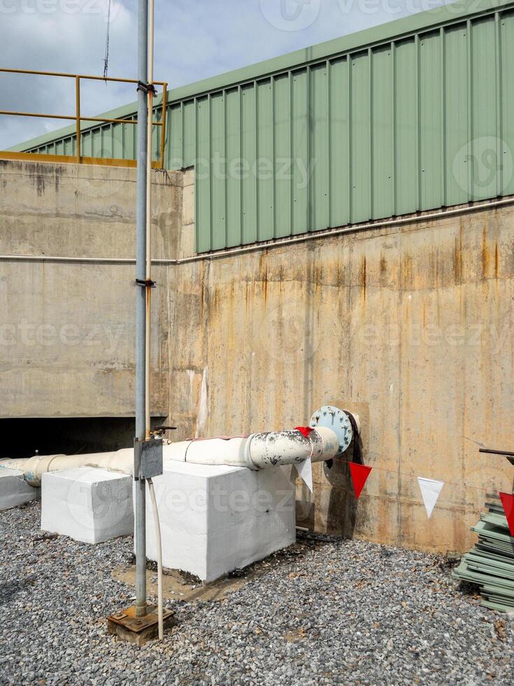 The metal pipe from the clean water storage tank. photo