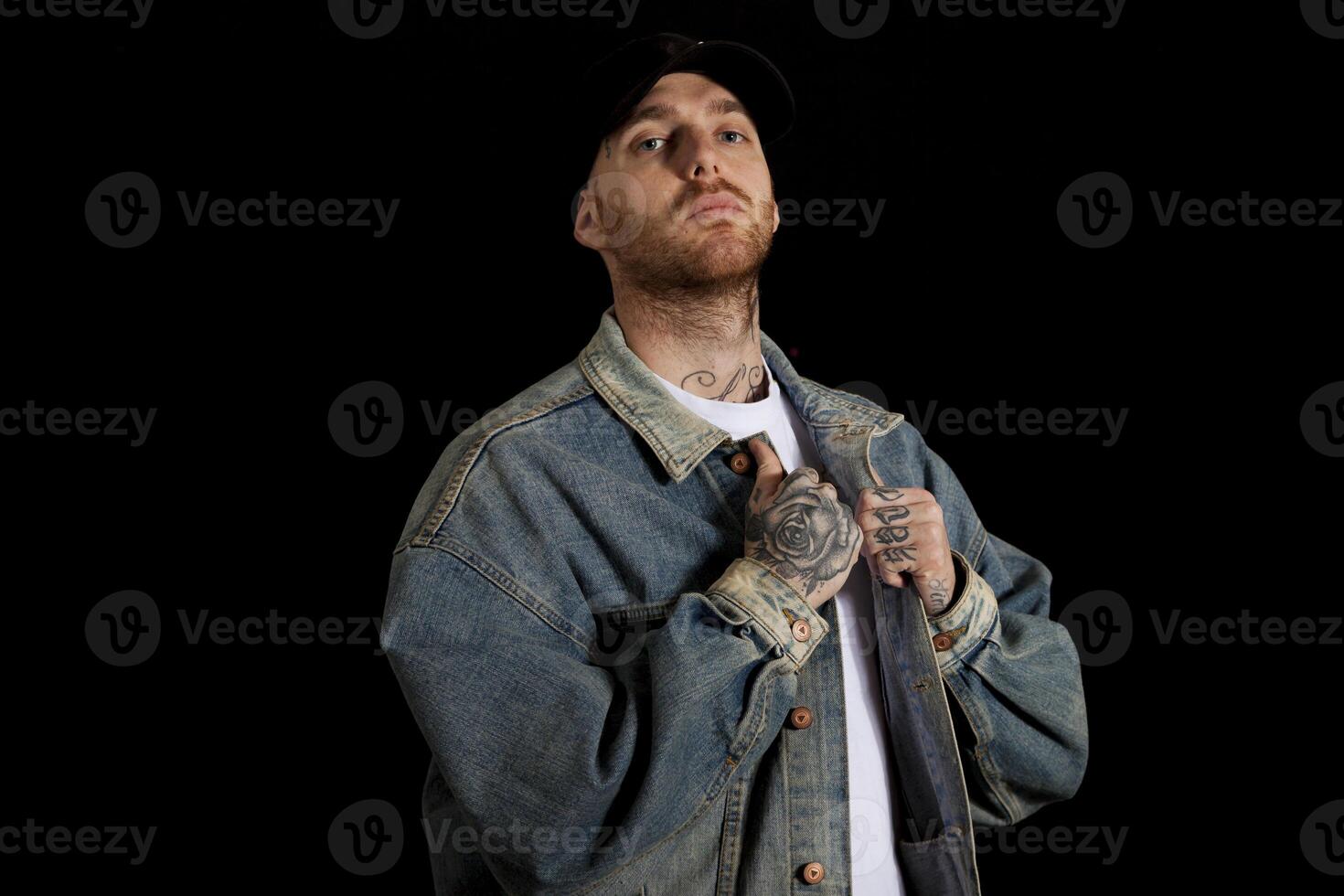 portrait of young active rapper in the studio photo