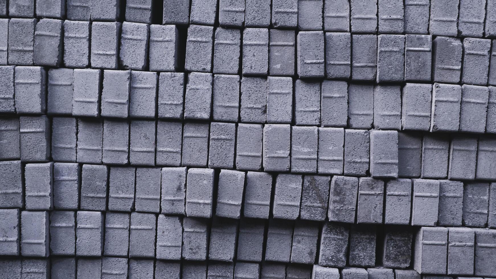 Pile of paving block, grey abstract textured background, copy space photo