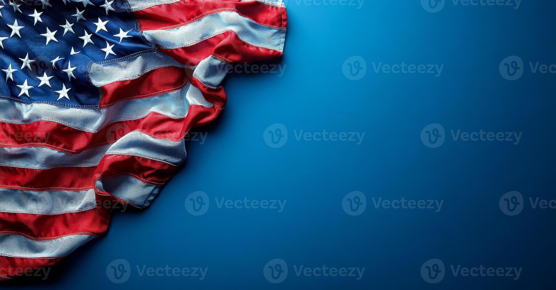 A blue background with a red and white American flag. The flag is folded and placed on the blue background photo