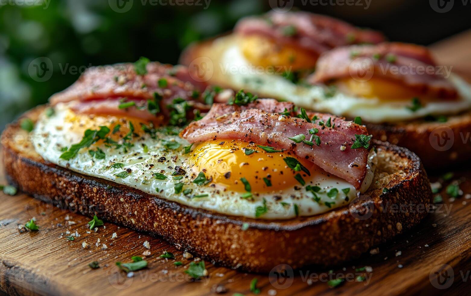 Savory slices of toasted bread topped with eggs and crispy bacon, garnished with herbs and spices, making a delightful breakfast. photo