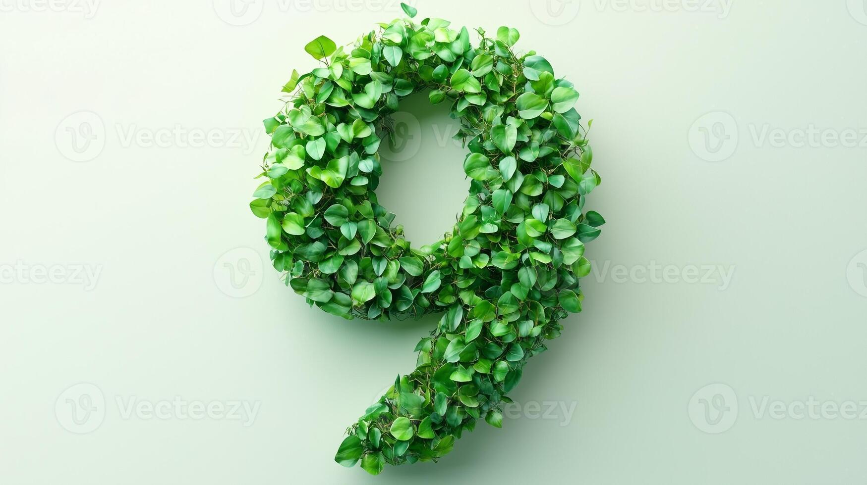The number 9 is framed by a series of green leaves solid background photo