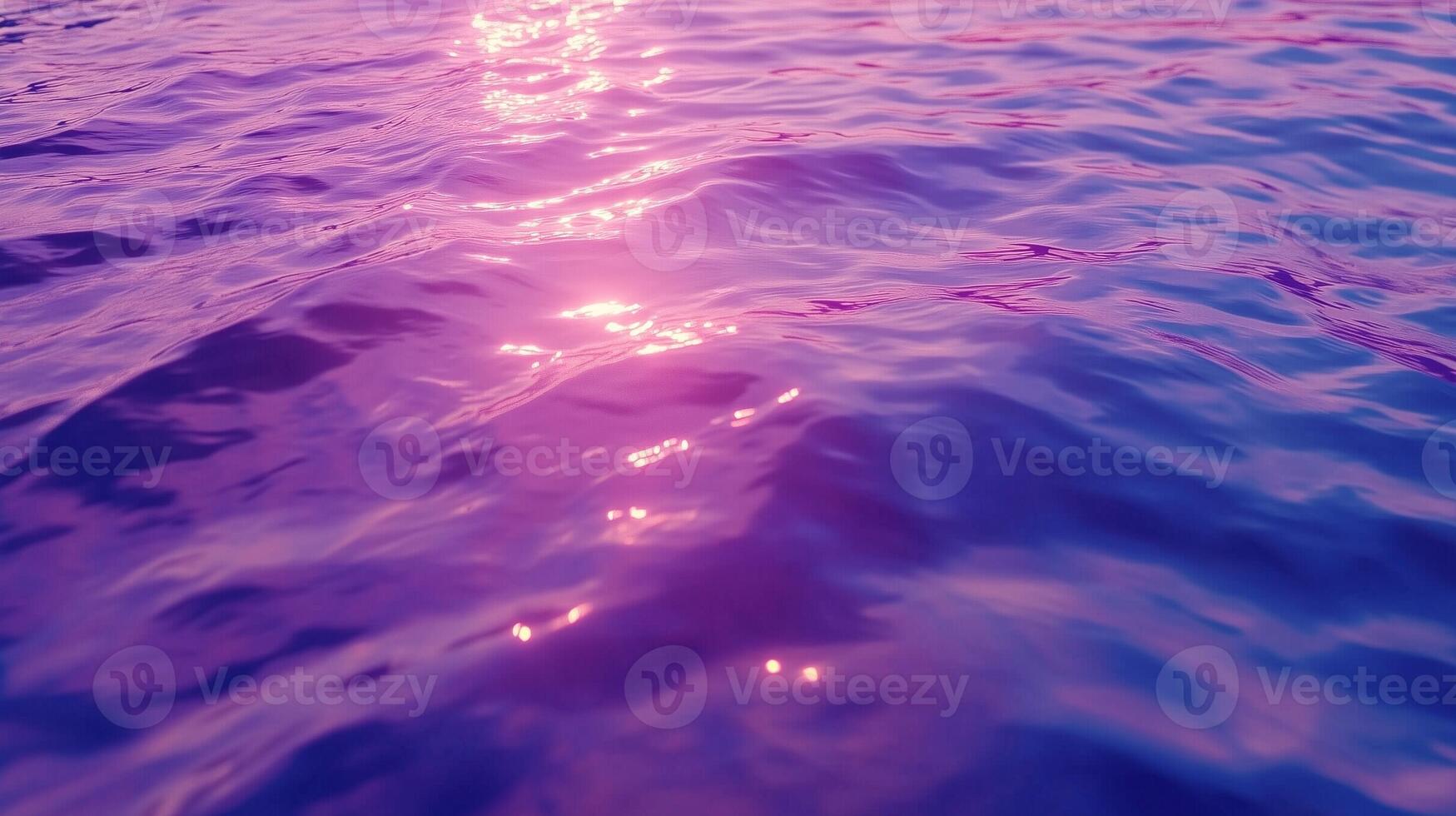 sea water surface with smooth wave and sunset light reflection photo
