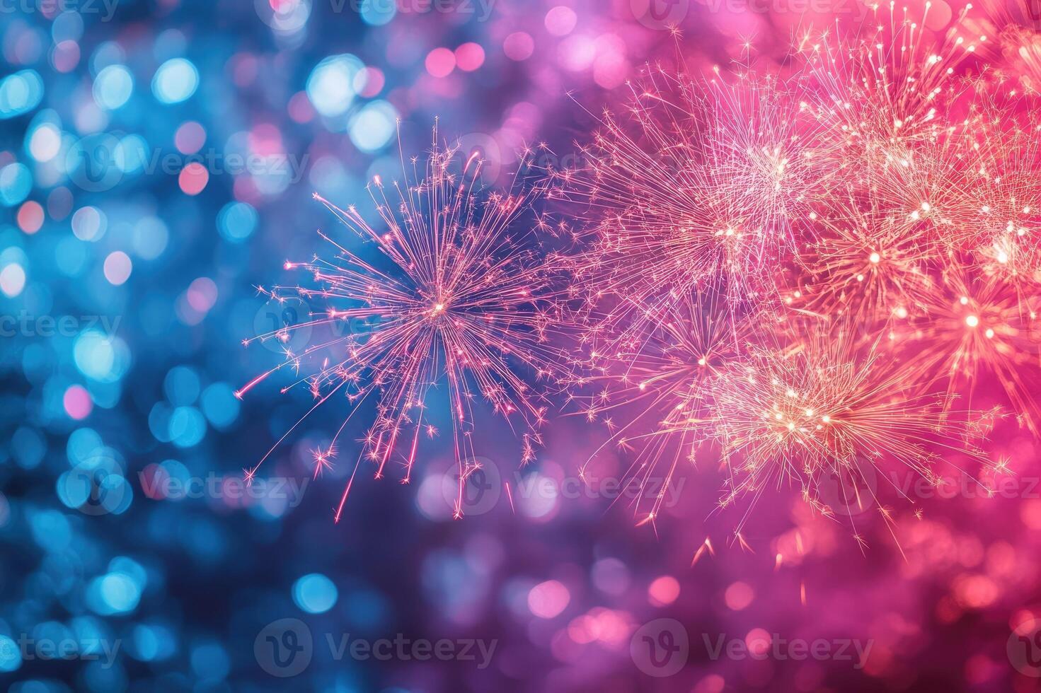Pink and blue festive background with sparkling fireworks exploding photo