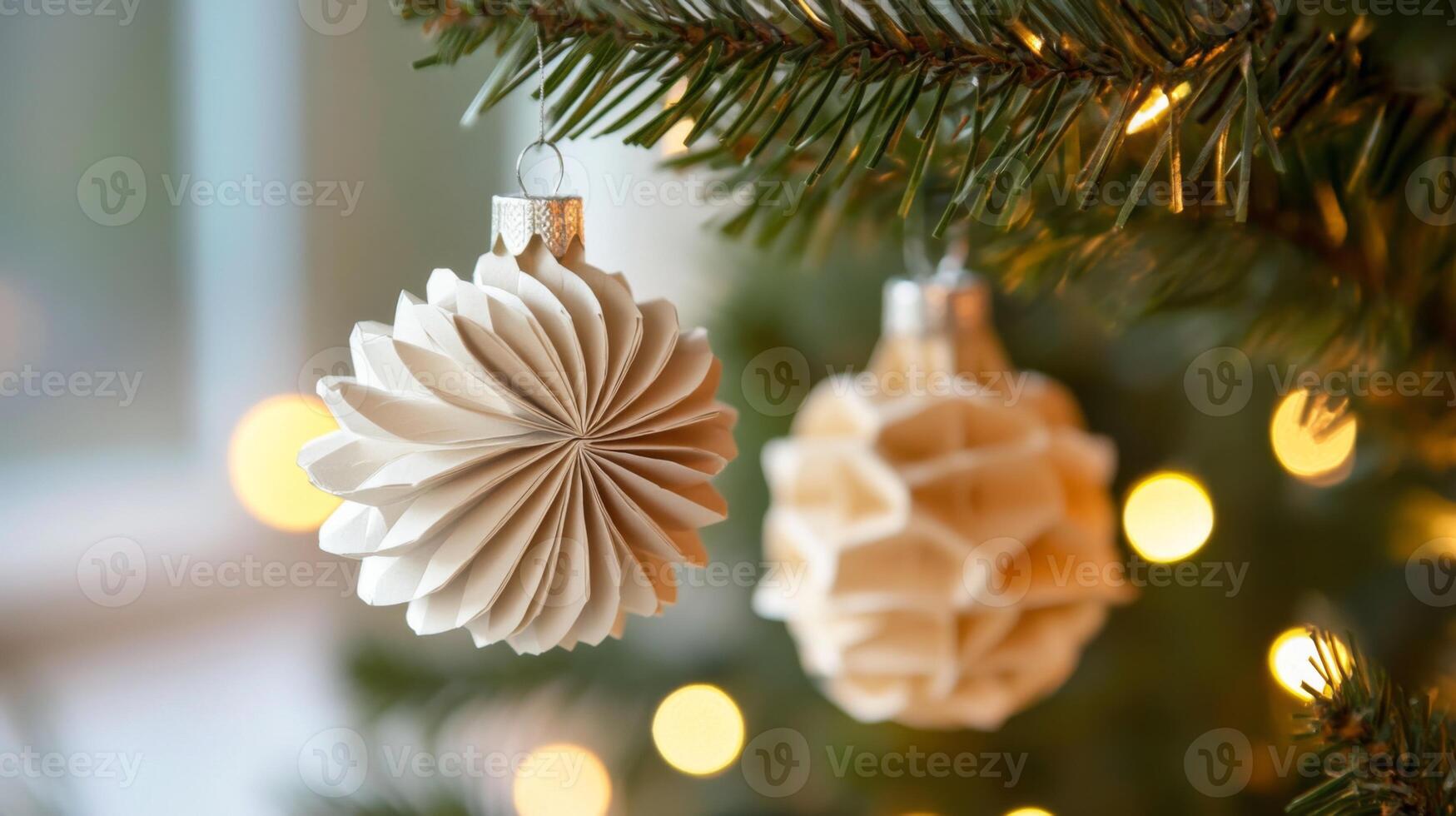 White Paper Christmas Ornaments Hanging on a Christmas Tree Branch photo