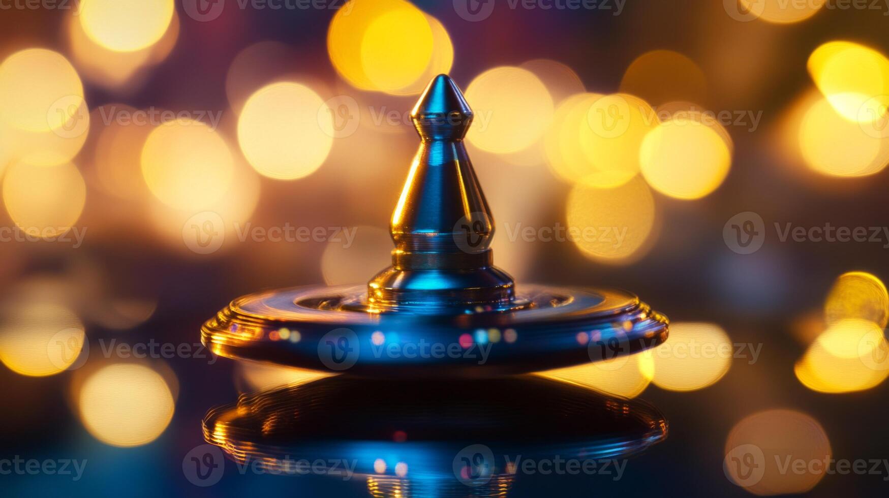 A Close-Up of a Shiny Metal Spinning Top Against a Blurred Bokeh Background photo