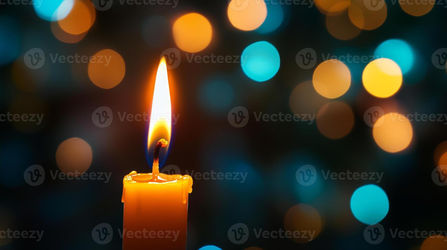 A Single Candle Flame Illuminated Against a Blurred Background of Warm and Cool Lights photo