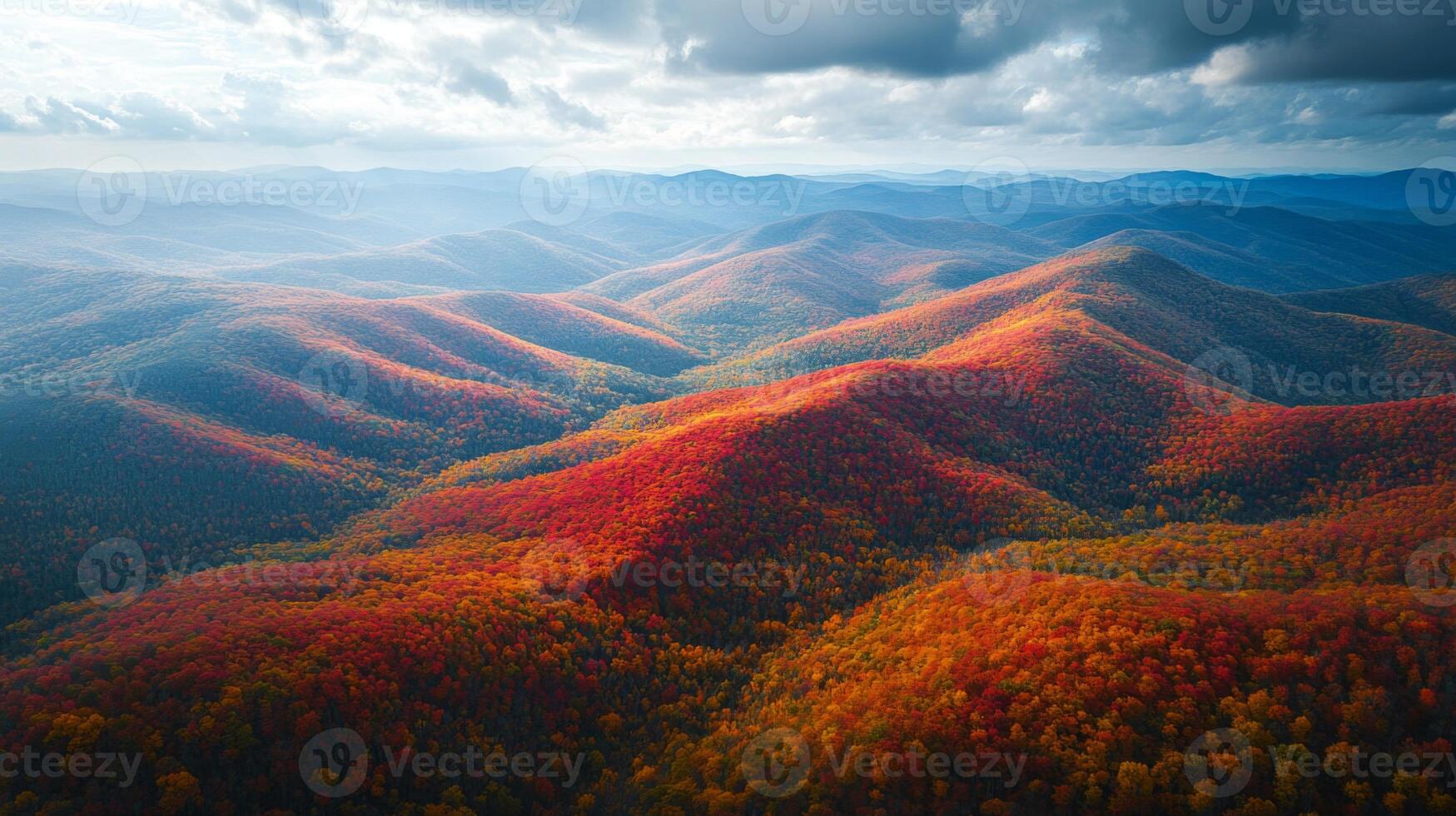 Aerial View of Rolling Hills Covered in Vibrant Autumn Foliage photo