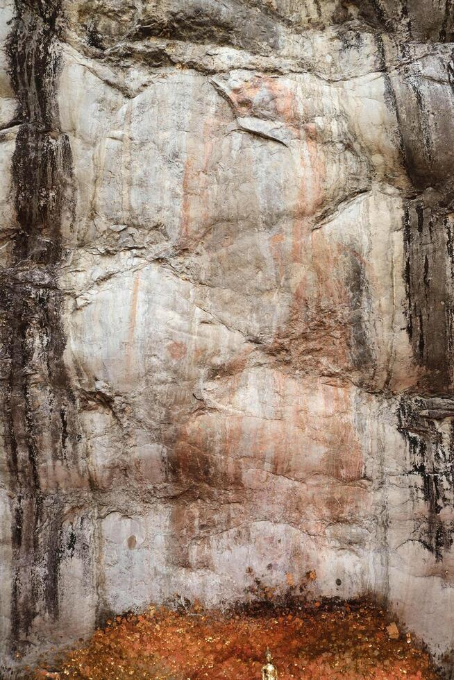 Phra Buddha Chai on the cliff rock at Wat Phra Phuttha Chai, Saraburi province. photo