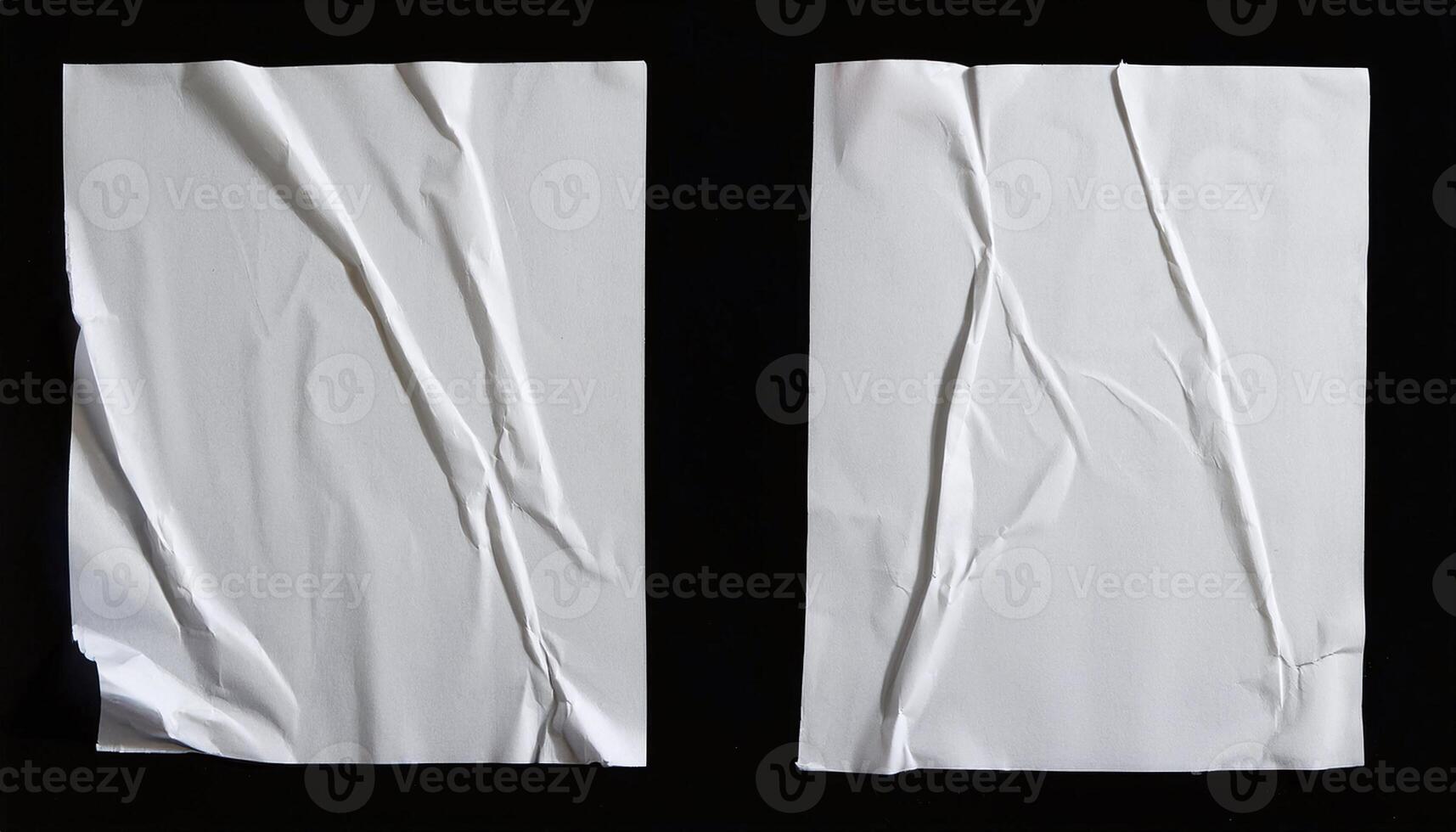 Two pieces of white paper with creases on them photo