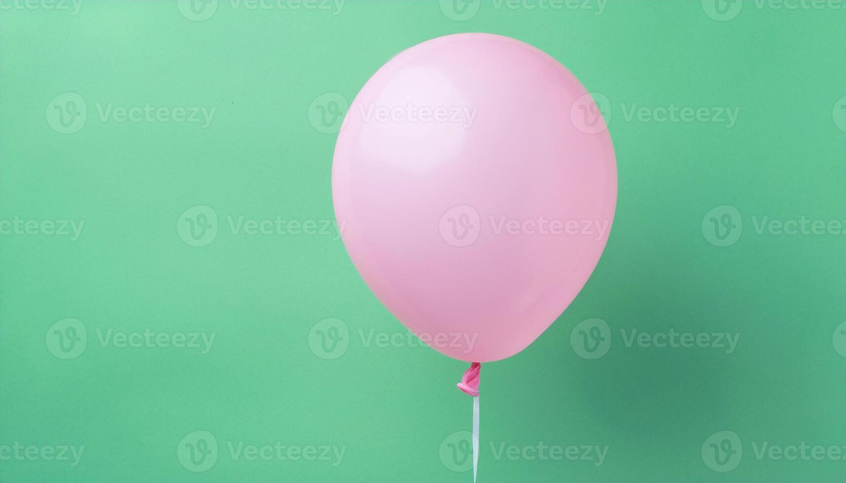 Pink Balloon Flying in Green Background photo
