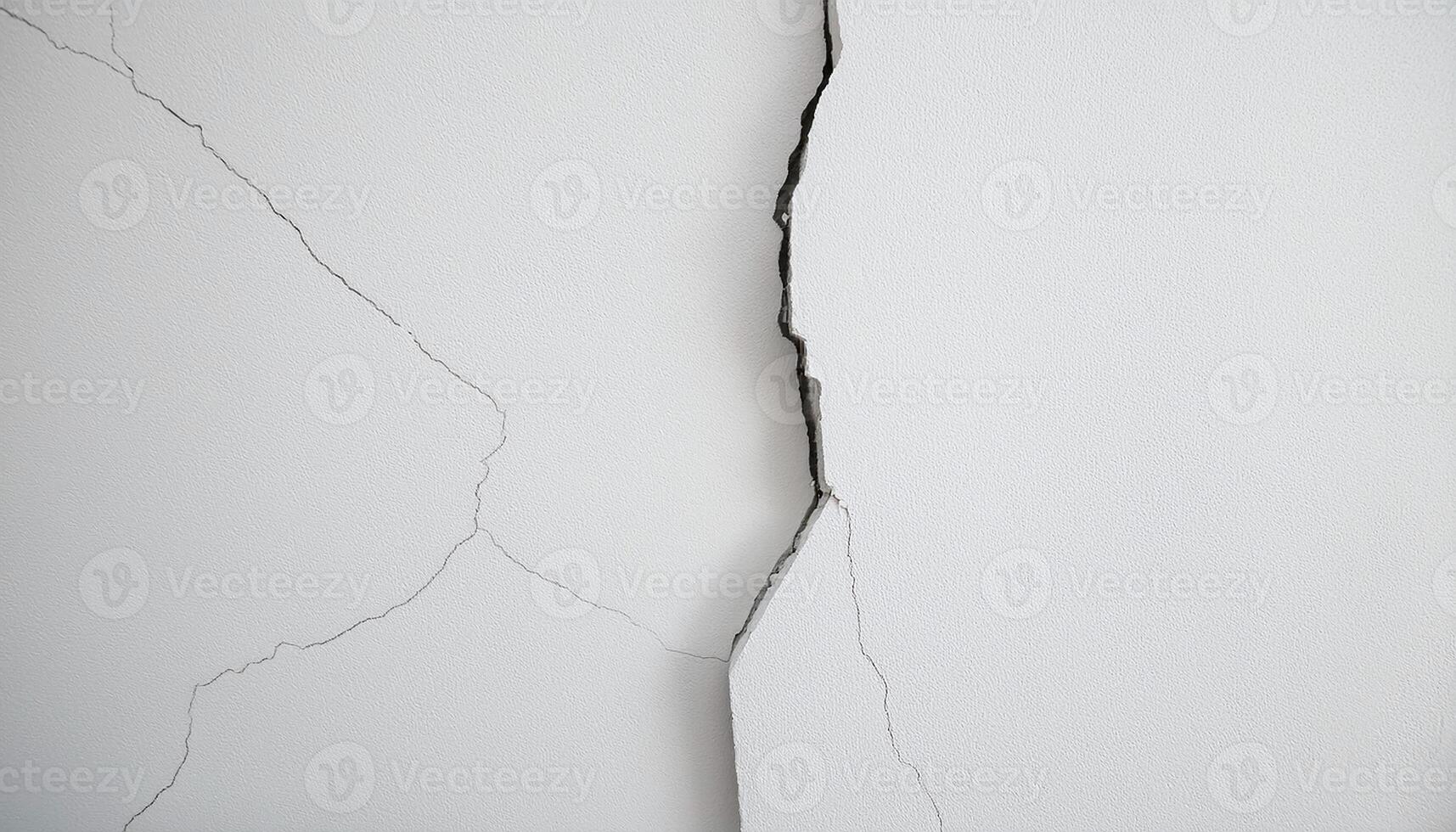 white wall with prominent crack running through the middle photo