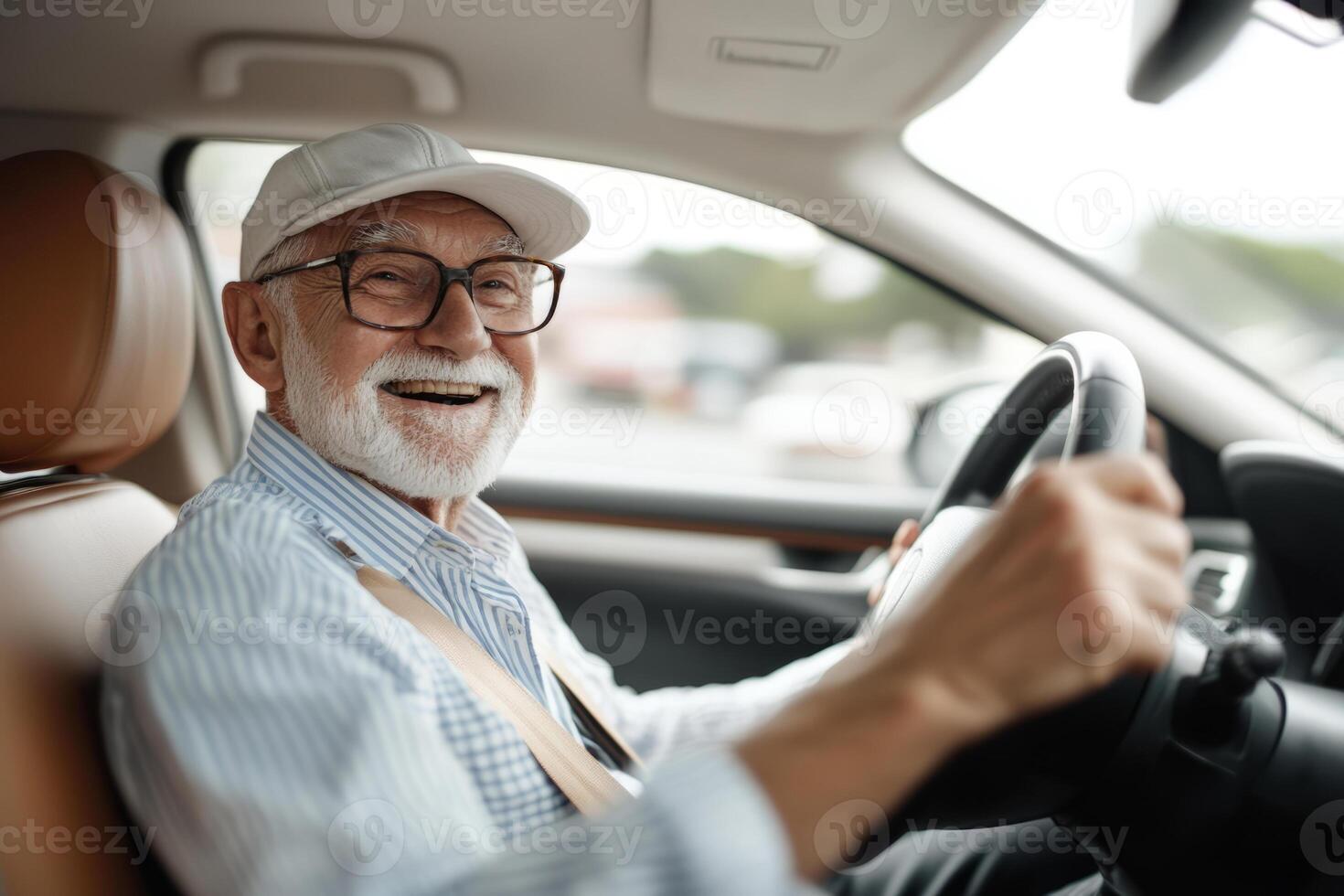 Senior man with glasses smiles while driving a car photo
