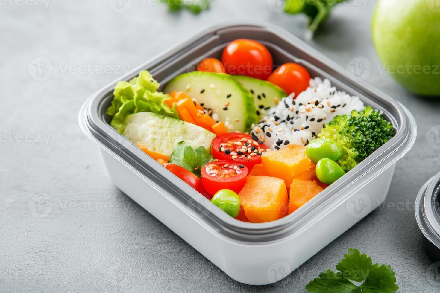 Bento box with fresh sashimi, rice, salmon and vegetables photo