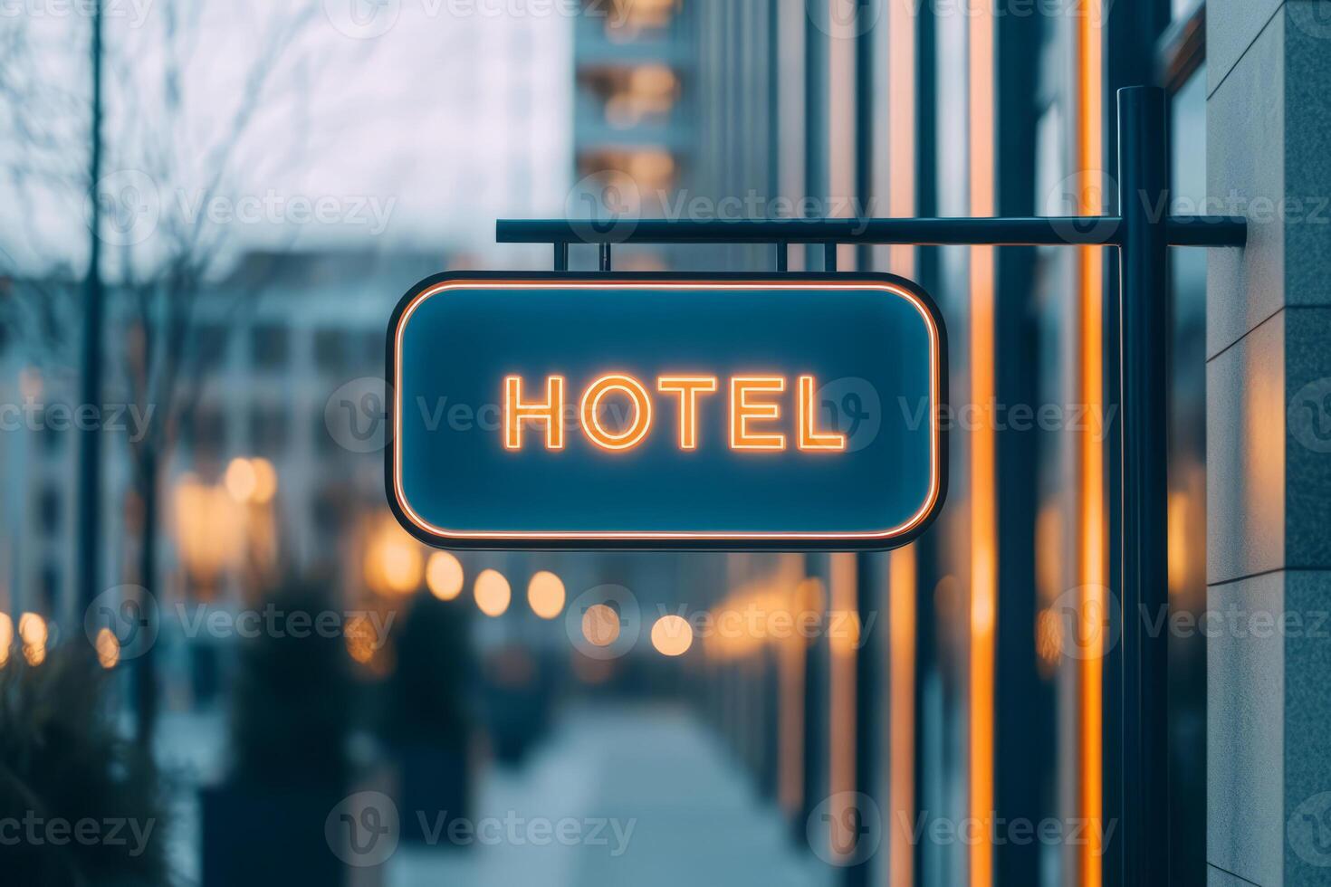 Hotel sign in a city street with blurred background. Urban atmosphere photo