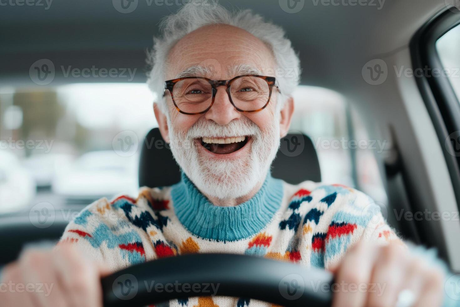 Senior man with glasses smiles while driving a car photo