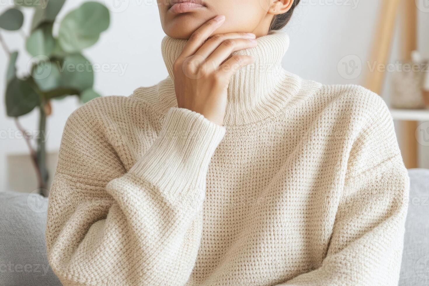 Woman wearing a beige turtleneck sweater photo