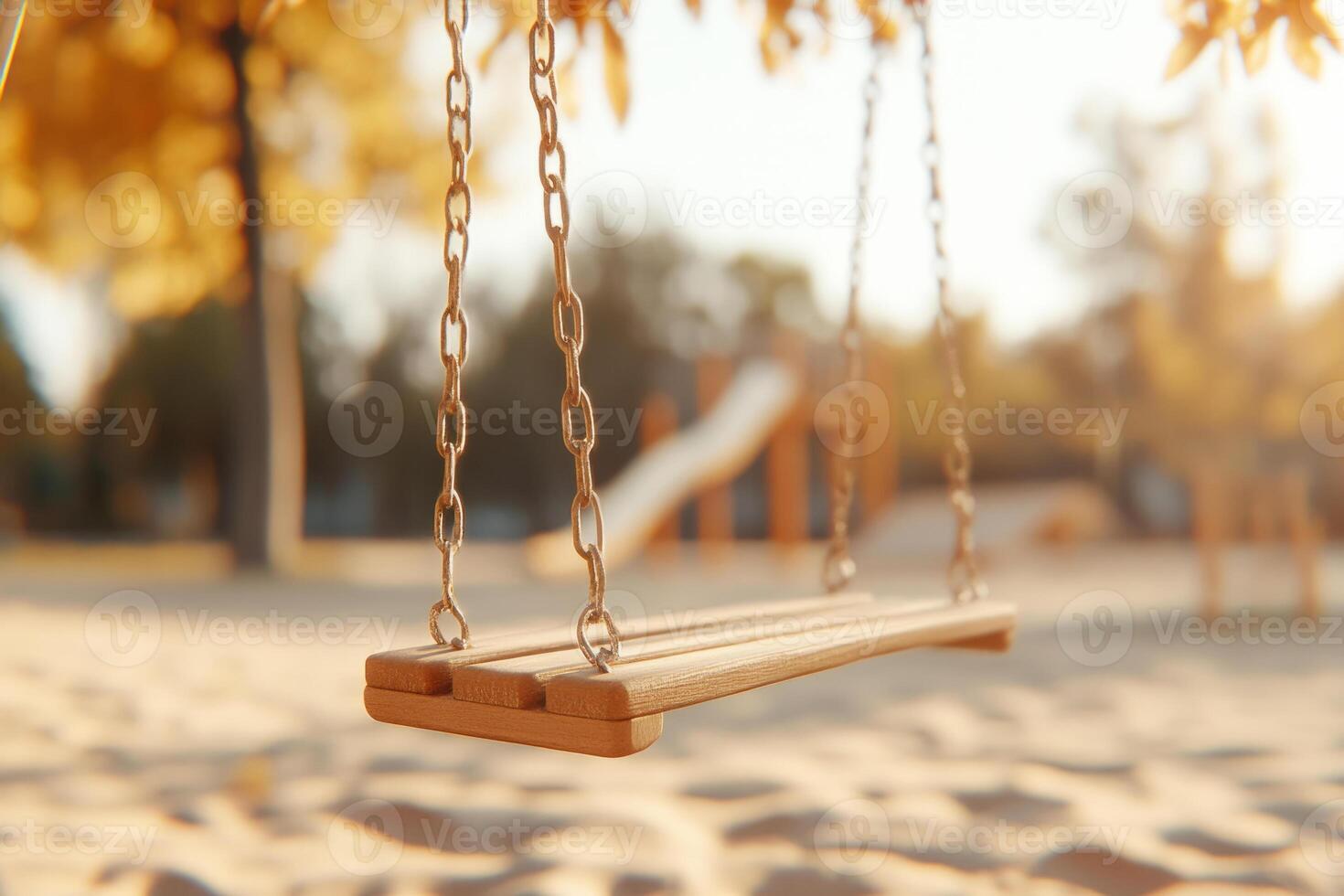 Empty swing hangs at a playground photo
