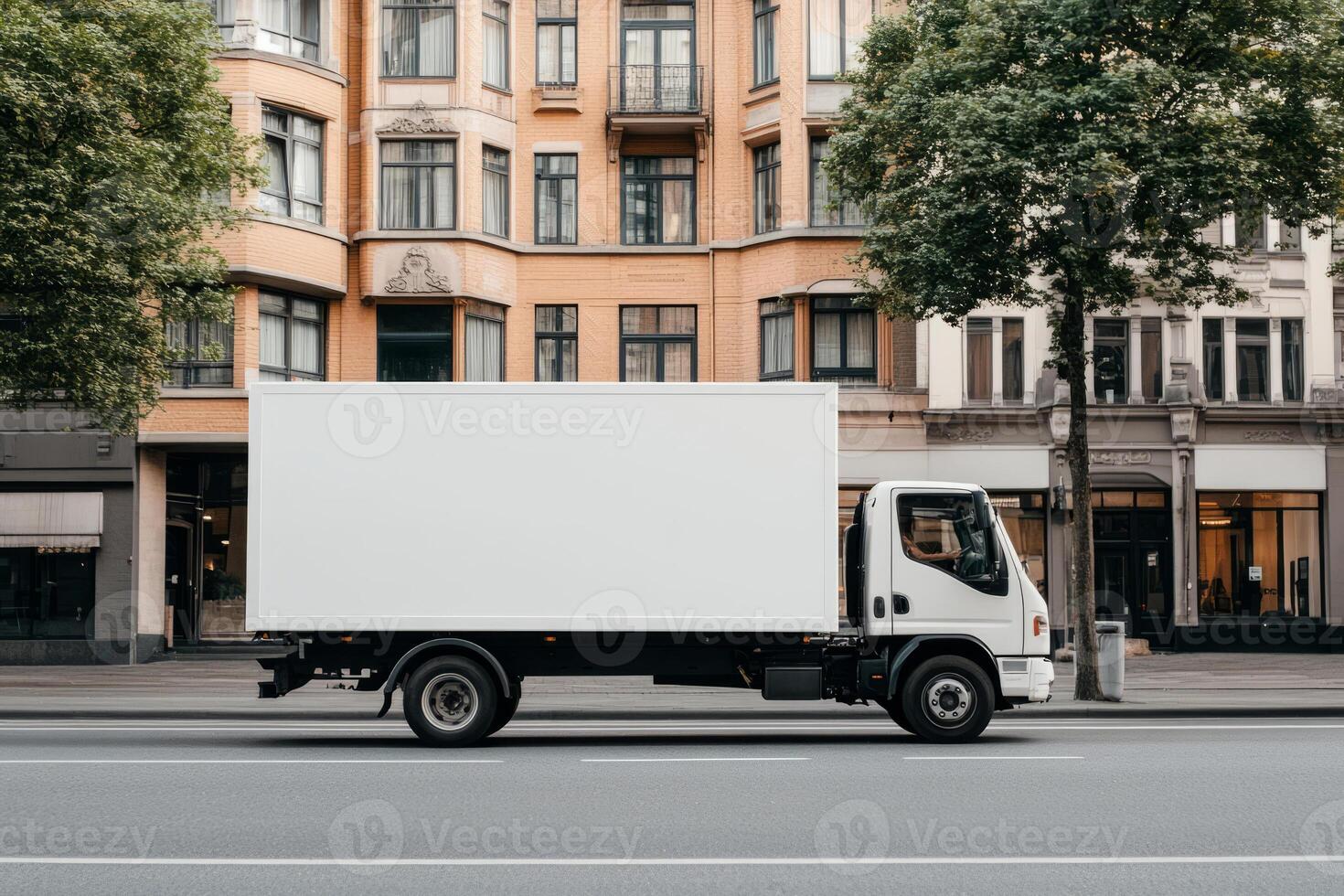 Empty blank white mockup of the truck on city street with buildings in the background photo