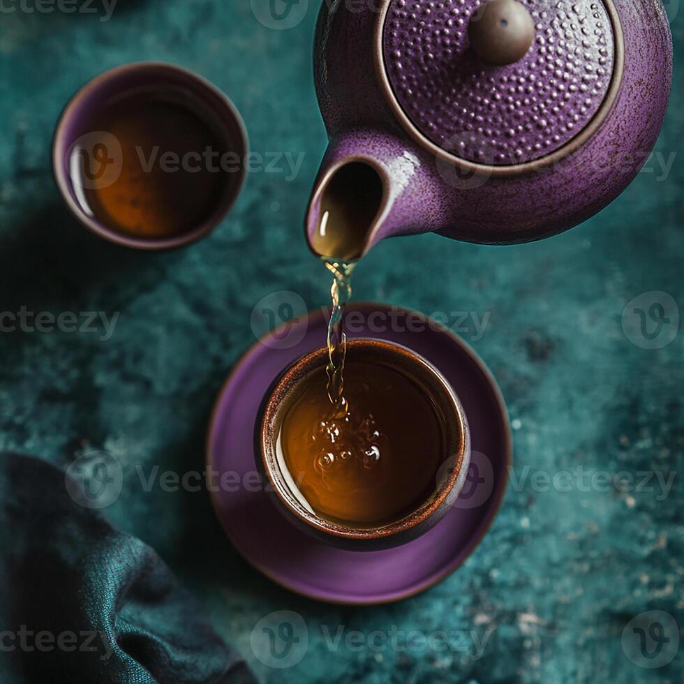 Tea pouring into a cup by julie for stocksy united photo
