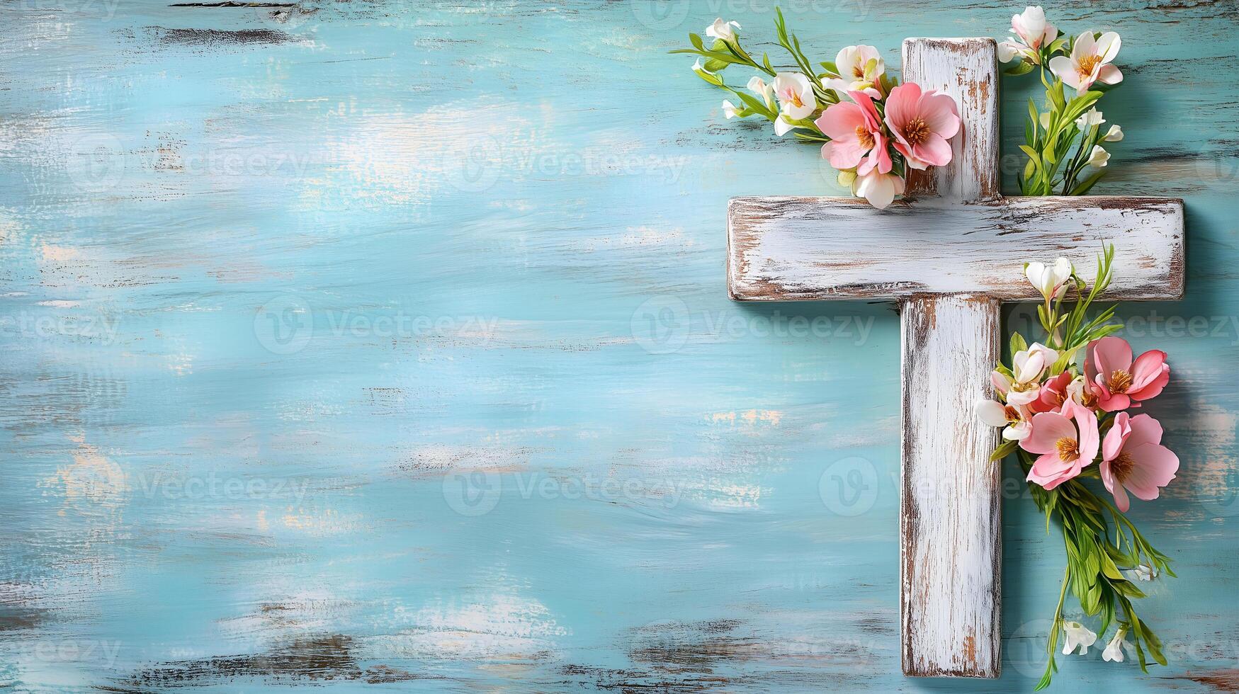Cross adorned with flowers on a textured blue background, symbolizing faith and peace photo