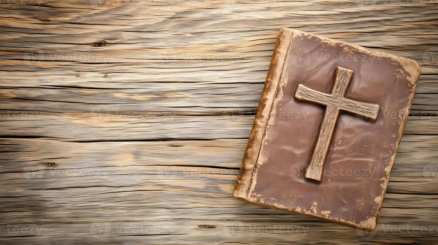 Wooden background with copy space featuring a cross on a book symbolizing faith and spirituality at rest photo