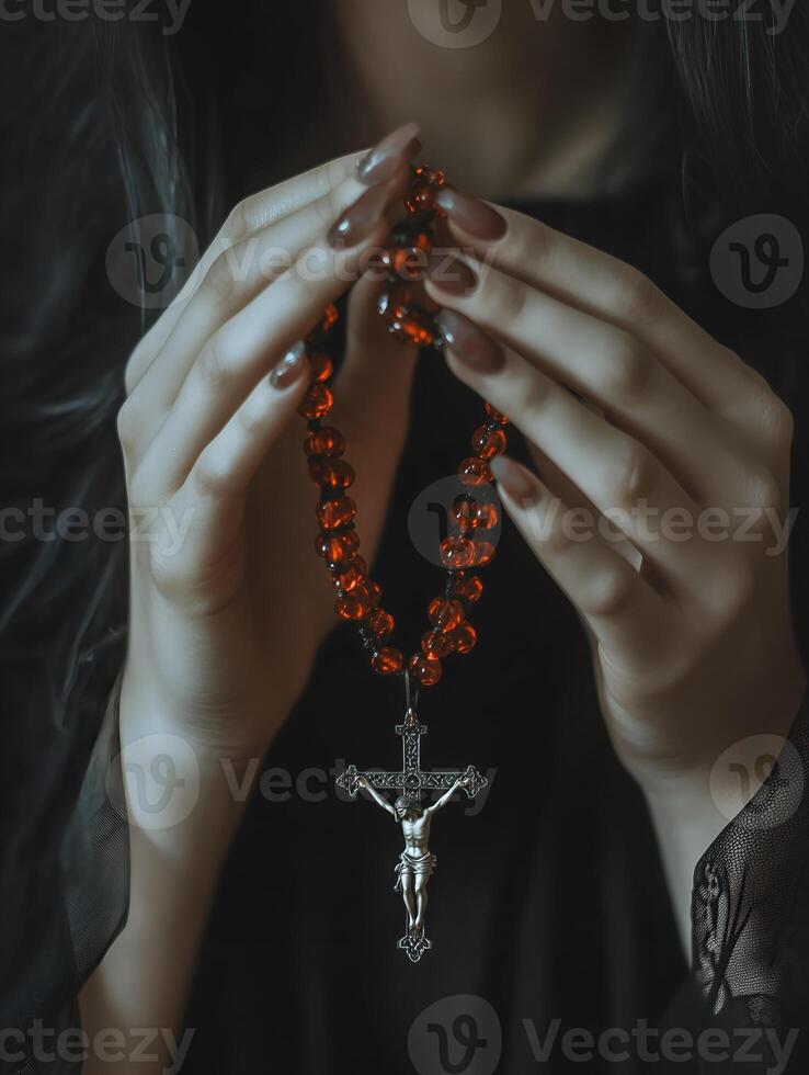 A person holds a rosary with a crucifix, engaging in prayer, reflecting deep spirituality and faith photo