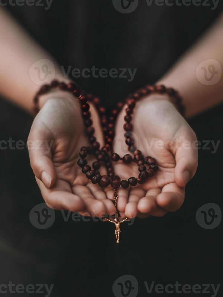A person praying with a rosary during a moment of reflection and devotion photo