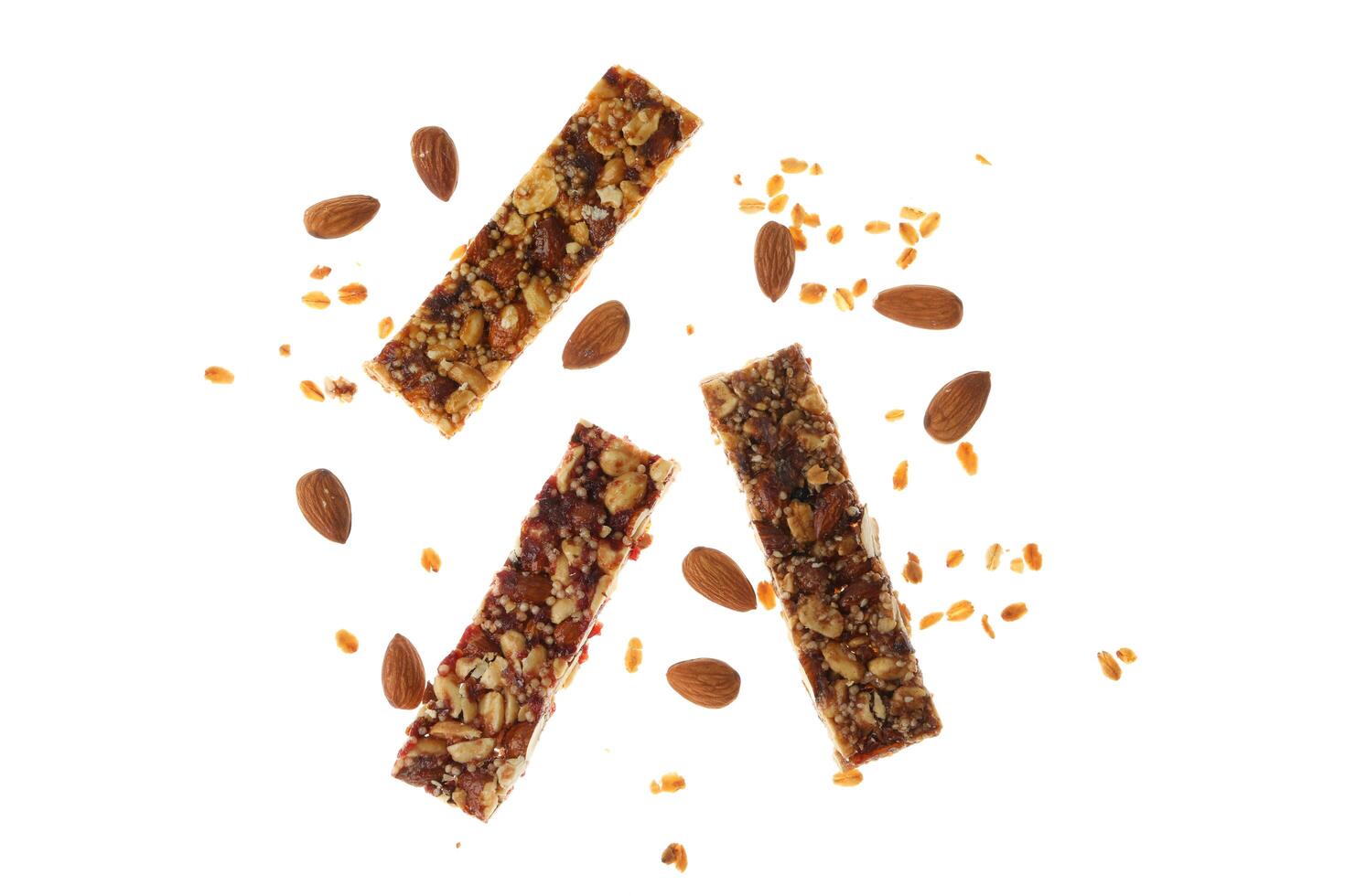 Tasty granola bars isolated on white background photo
