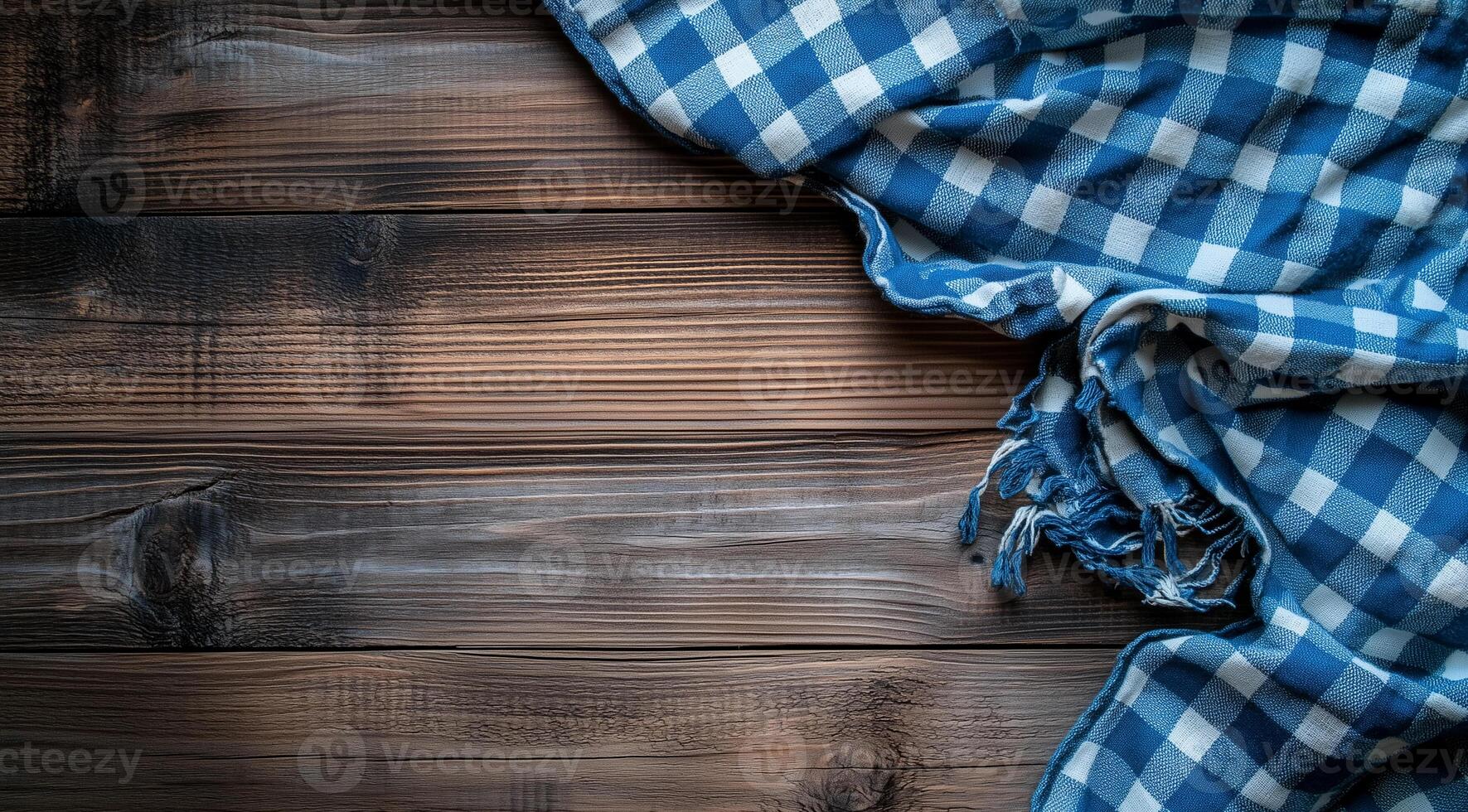 Blue and white checkered plaid on wooden background, top view with space for text photo