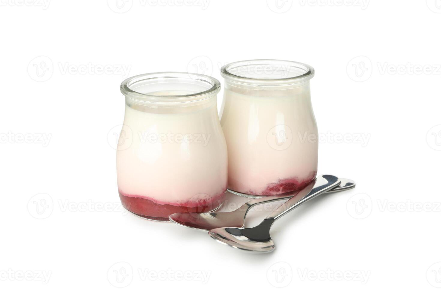 Bottles of sour cream yogurt and spoons isolated on white background photo