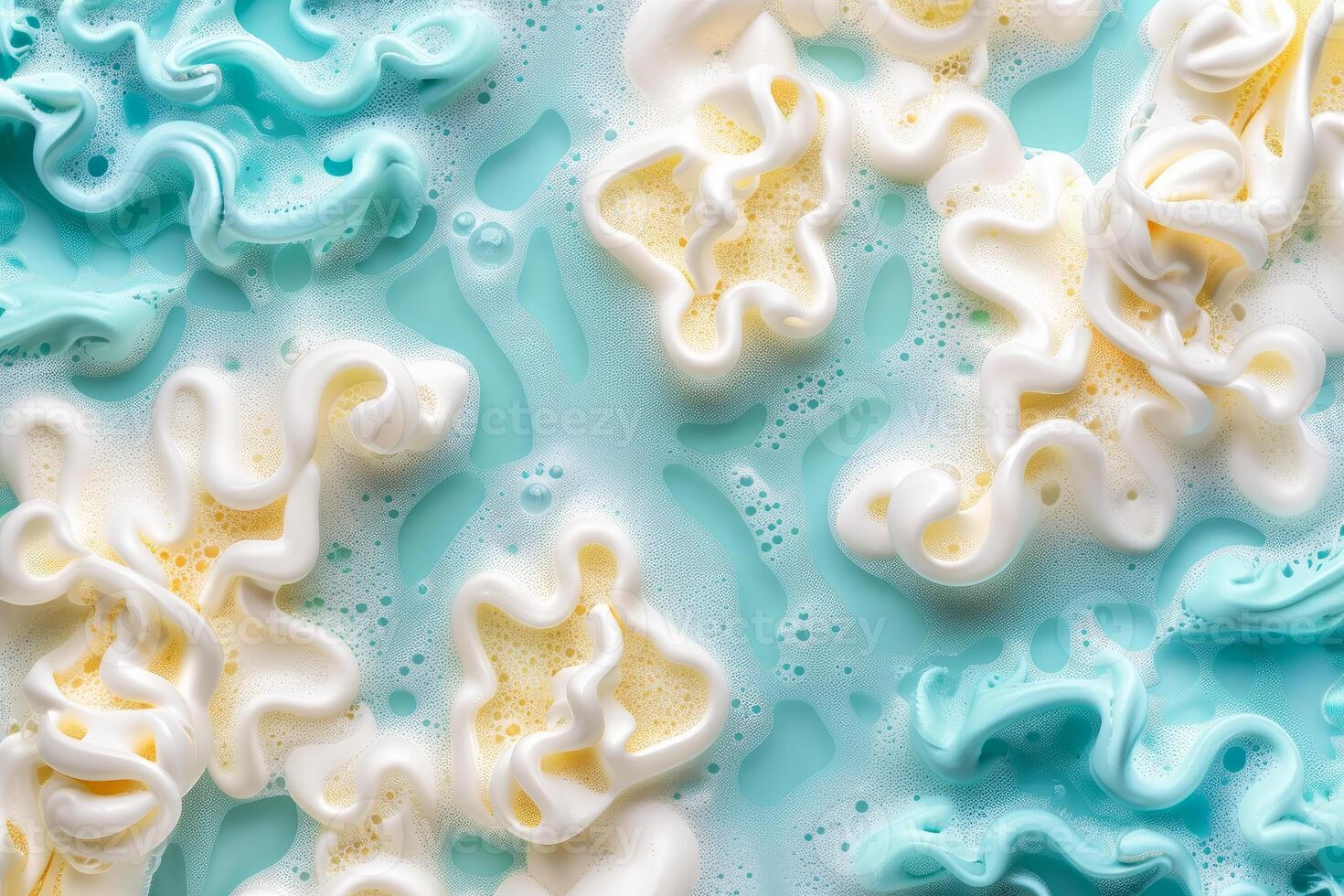 White and blue cosmetic cream creating swirling and mixing pattern on a turquoise background photo