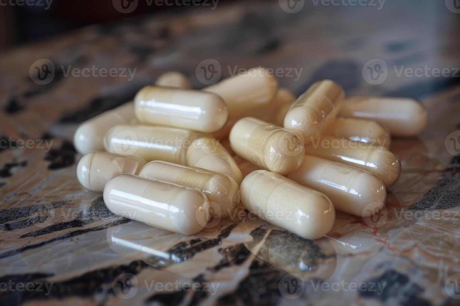 Pile of white pills sitting on marble surface photo