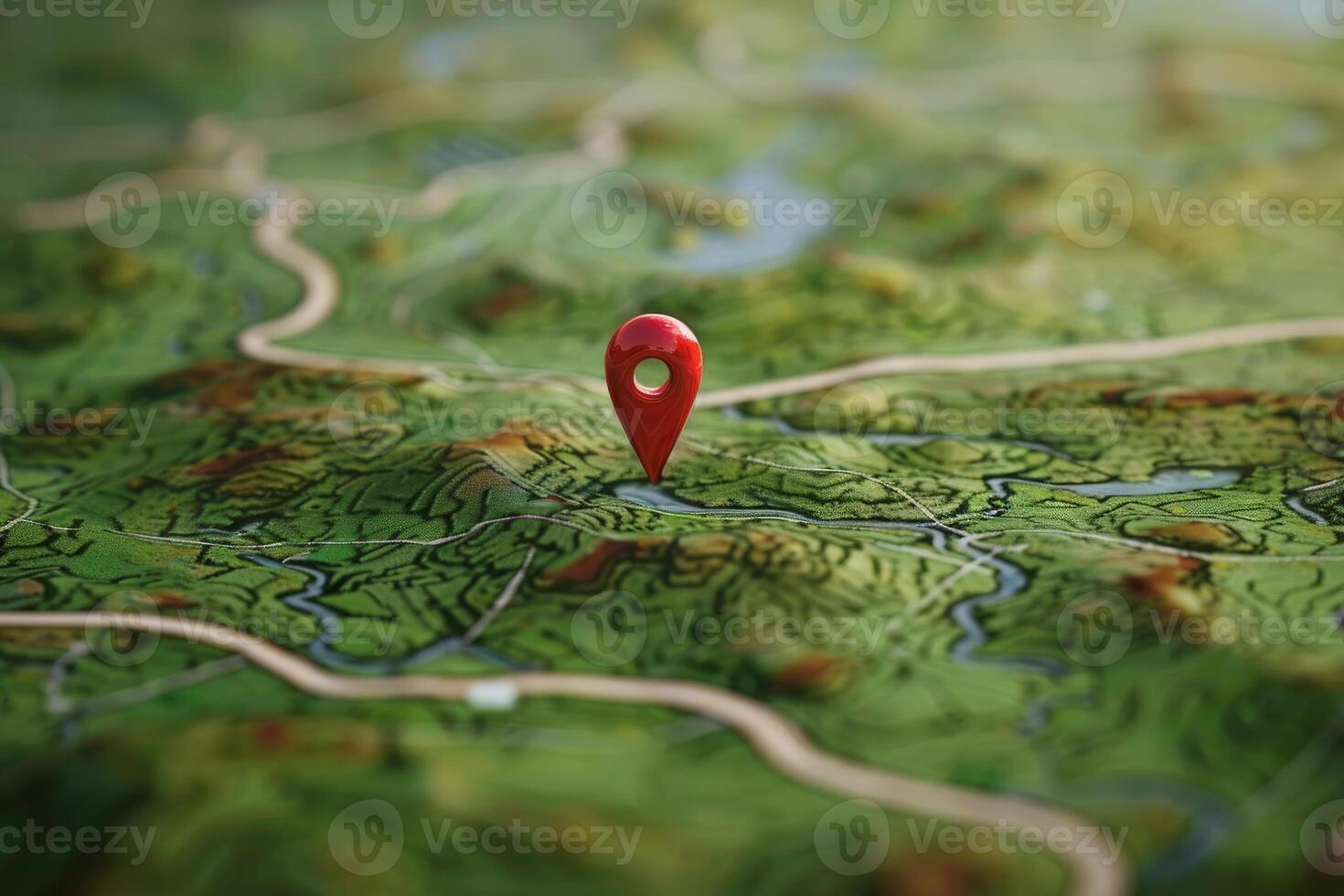 Red location pin pointing on a green topographic map photo